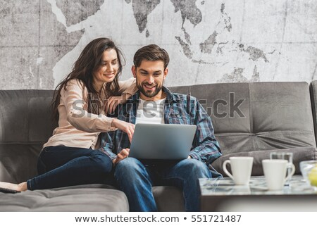 Stock fotó: Couple Relaxing On Sofa With Coffee And Laptop