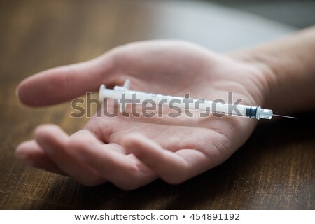 Stock fotó: Hand Addict And Syringe With A Drug