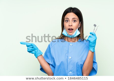 [[stock_photo]]: Surprised Doctor Woman Presentation Gesture