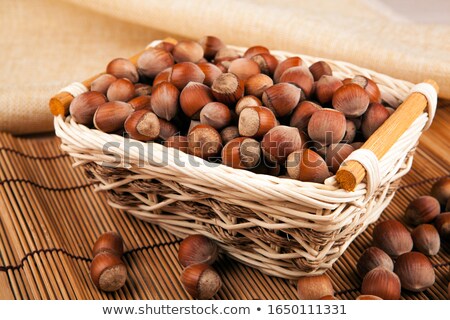 Stock photo: Whole Hazelnut Kernels In A Wicker Basket Still Life