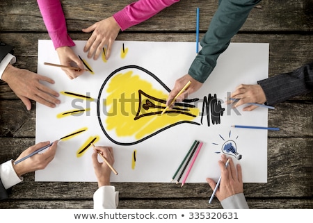 Foto stock: Bulb And Team Of Paper Man