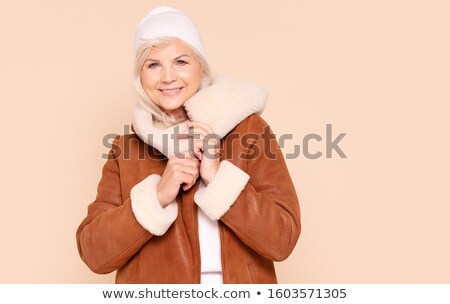 Happy Woman Wearing A Winter Cap Zdjęcia stock © NeonShot