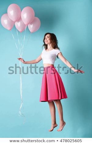 Foto stock: Happy Girl Flying With A Balloon Flying