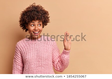 Foto stock: Casually Dressed Girl Says Hello