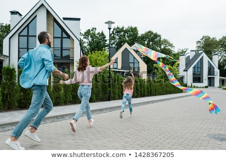 Foto stock: Family Of Three Building Kite
