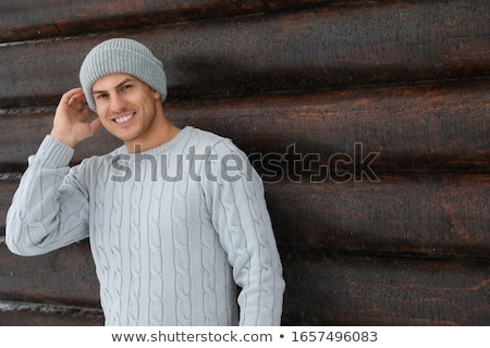 Stok fotoğraf: Beautiful Winter Portrait Of A Handsome Man In A Knitted Hat