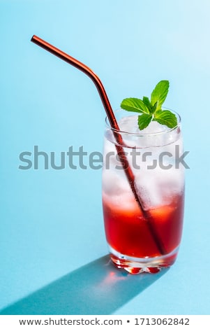 Foto stock: Glass Of Iced Mineral Water With Ice Cubes And Strawberry