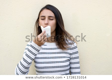 Stok fotoğraf: Pretty Woman Mouth Blowing Cold Breeze