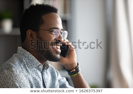 Foto stock: Holding Telephone Device From Profile