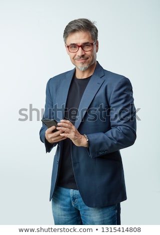 Stok fotoğraf: Older Businessman Using A Cellphone