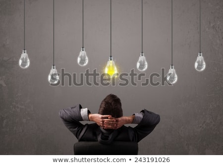 Сток-фото: Businness Guy In Front Of Idea Light Bulbs Concept