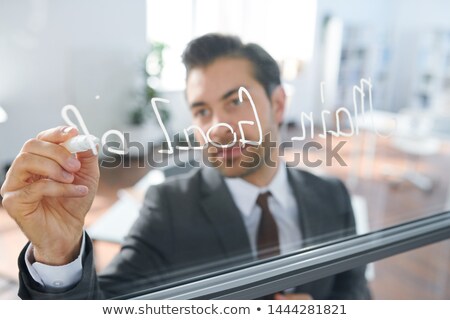 Zdjęcia stock: Business Coach With White Highlighter Writing Down On Board