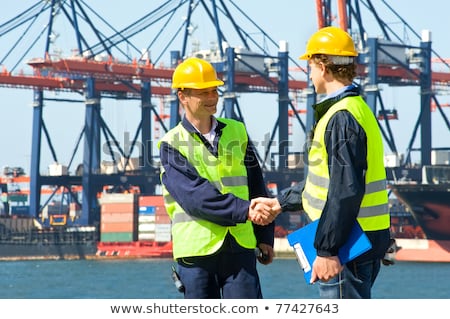 Stock photo: Two Dockers Shaking Hands