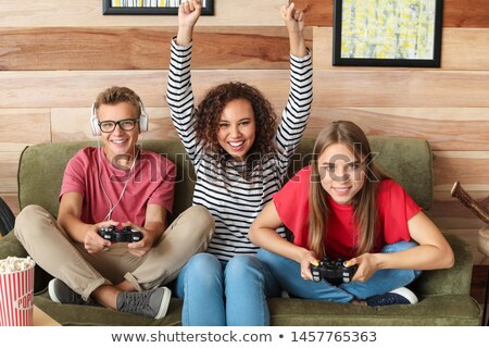 Stock fotó: Portrait Of Teenagers Playing Video Game