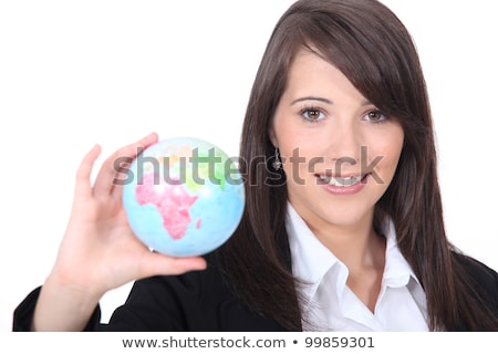 Foto stock: Brunette Holding Miniature Globe