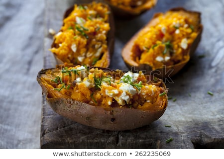 Foto stock: Homemade Cooked Sweet Fried Potato With Onions And Herbs On Wood