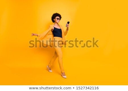 Stockfoto: Full Length Photo Of Joyful Afro American Woman Wearing Black Dr