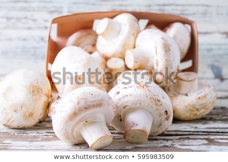 Foto stock: Champignon Mushrooms On The Wooden Board