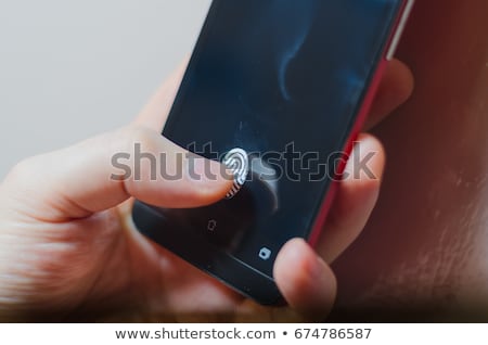 Foto stock: Fingerprint Scanner On Phone Screen Biometric Identification And Approval Concept