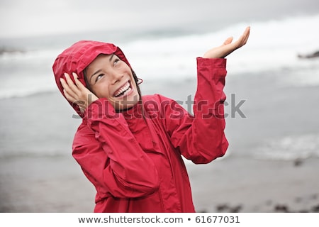 Stockfoto: Girl Enjoying The Rain And Having Fun Outside On The Beach A Gray Rainy