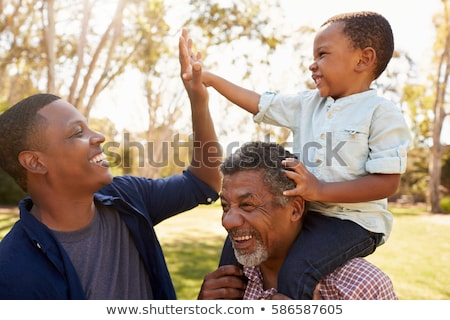 Stock foto: Grandfather And Grandson Racing At Summer Park