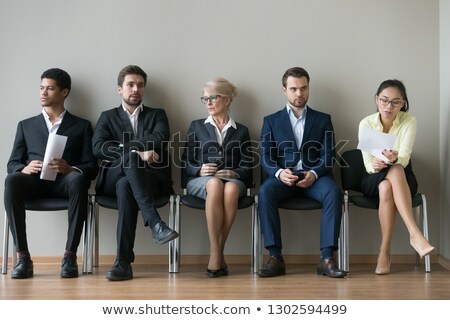 Foto stock: Businessman Sitting On A Chair And Waiting For A Meeting