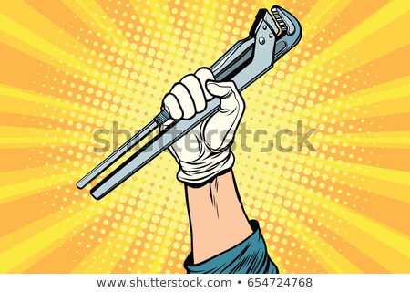 Stock photo: Old Rusted Adjustable Vector Wrench In A Hand