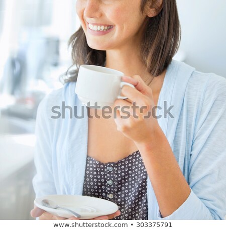 ストックフォト: Smiling Happy Girl In Sweater Holding Tea Cup