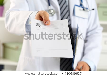 [[stock_photo]]: Doctor Giving Prescription To Patient At Hospital