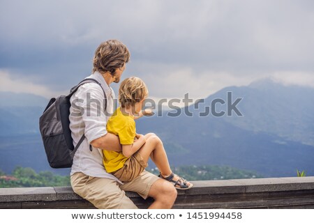 Zdjęcia stock: Boy Tourist On Background Looking At Batur Volcano Indonesia Traveling With Kids Concept