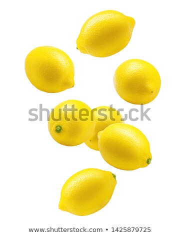 Foto d'archivio: Yellow Lemons Levitate On A White Background