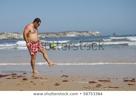 Stock fotó: Fat Man Playing With A Ball On The Beach