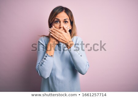 Stockfoto: Attractive Middle Aged Woman Gesturing Silence