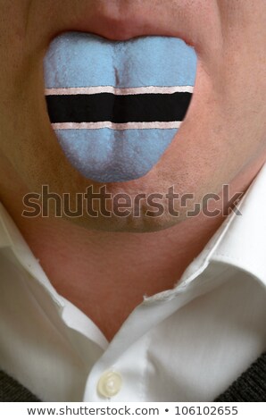[[stock_photo]]: Man Tongue Painted In Botswana Flag Symbolizing To Knowledge To