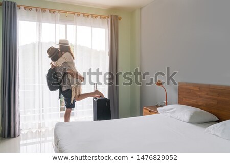 Stok fotoğraf: Traveler Couple In Love With Backpacks Indoors