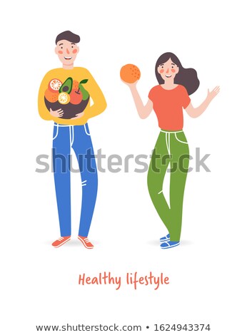 Stok fotoğraf: Basket Of Mandarins In The Hands Of A Woman