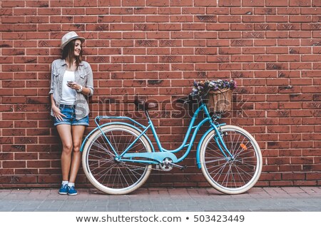 Imagine de stoc: Woman Near Wall With Headphones