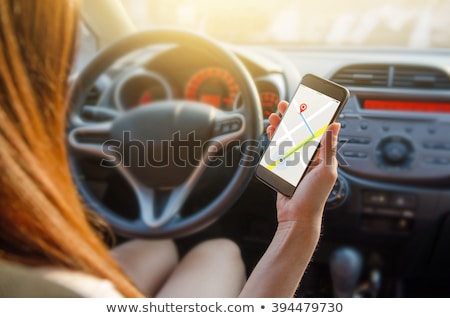 Сток-фото: Woman Using Car Navigation On Smartphone