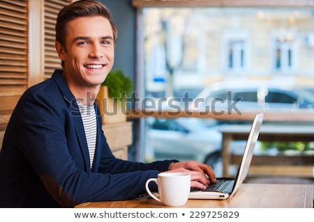 Stock photo: Young Man With Hot Drink