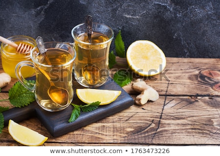 Foto stock: Healthy Tea Two Cups With Lemon Ginger Mint