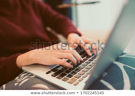 Stok fotoğraf: Woman Typing On Laptop Keyboard