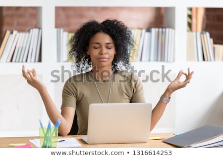 Stock fotó: Businesswoman Doing Yoga In Office