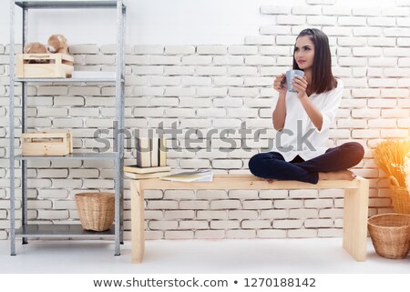 Stockfoto: Pretty Young Lady Relaxing In A Wooden Chair