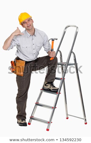 Foto d'archivio: Craftsman Making A Call Sign With His Hand