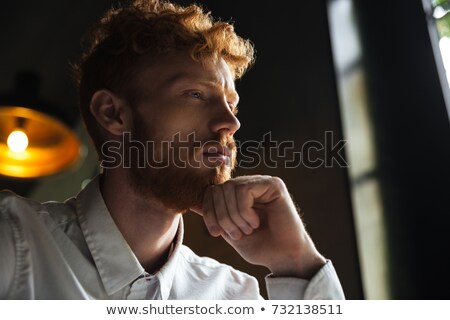 Stockfoto: Close Up Portrait Of Young Readhead Bearded Overworked Man In Wh