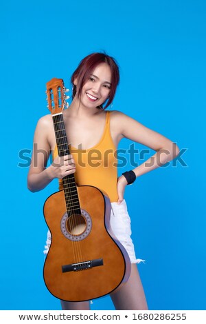 Сток-фото: Woman Holding Acoustic Guitar