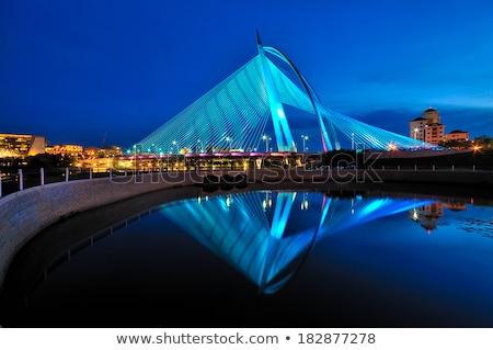 Stockfoto: Highlighted Bridge At Night And Reflected In The Water