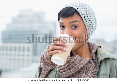 Stock photo: Fashionable Young Woman Sipping Hot Tea