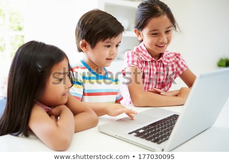 Stock photo: Brother And Sister Using Laptop
