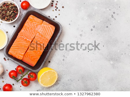 Stock fotó: Plastic Container With Fresh Salmon Slice With Oil Tomatoes And Lemon On Stone Kitchen Background W